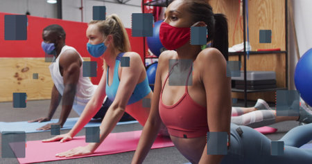 Image of notebook icons over diverse people wearing face masks and exercising at gym. Global lifestyle, family and digital interface concept digitally generated image.の写真素材