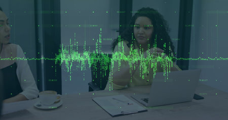 Image of financial data processing over diverse business people at office. Global finances, business and digital interface concept digitally generated image.の写真素材