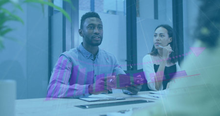 Image of graph over diverse business people having meeting at office. Global business, online...