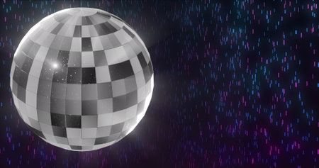 Image of disco ball over light spots on black background. Party and celebration concept digitally generated image.の写真素材