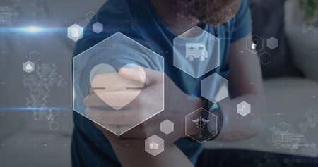 Image of digital icons data processing over caucasian man rubbing arm. Global medicine, computing, digital interface and data processing concept digitally generated image.の写真素材