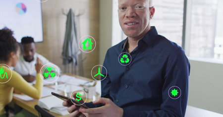 Image of icons over albino african american businessman using tablet at office. Global business,...