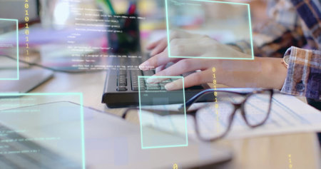 Image of data processing over hands of biracial businesswoman using computer at casual office. Connection, business, digital interface, data and communication, digitally generated image.の写真素材