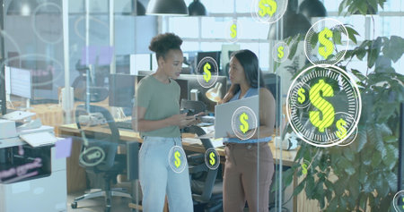 Image of dollar signs and data processing over diverse businesswomen in office. Global finance,...