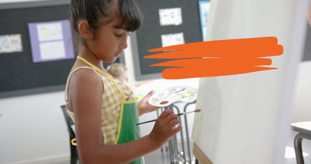 Painting on canvas, child in apron with palette over orange brushstroke image. art, creativity, childhood, artist, color, brushesの写真素材