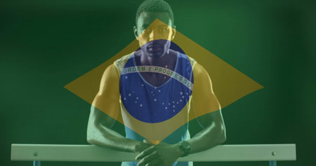 Image of flag of brazil over african american male athlete. Global sports, sport disciplines and flags concept digitally generated image.の写真素材