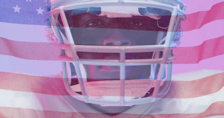 Image of african american american football player and flag of usa. American patriotism, sports and competition concept digitally generated image.の写真素材