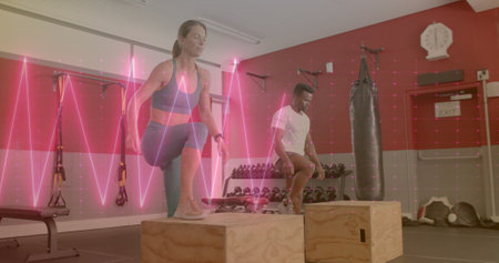 Image of data processing over diverse man and woman exercising in gym. Sports, active lifestyle and...