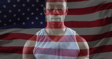 Image of flag of usa over african american male basketball player. Global sports, sport disciplines and flags concept digitally generated image.の写真素材