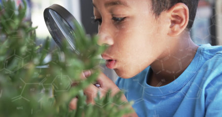 Examining plants with magnifying glass, child observing nature, scientific image over. exploration, curiosity, science, biology, education, discoveryの写真素材
