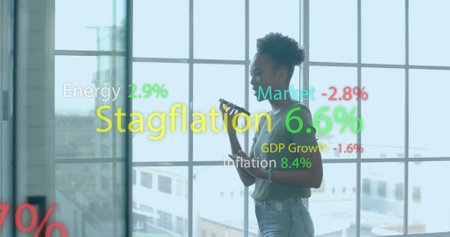 Image of financial data processing over african american businesswoman in office. Global finance,...