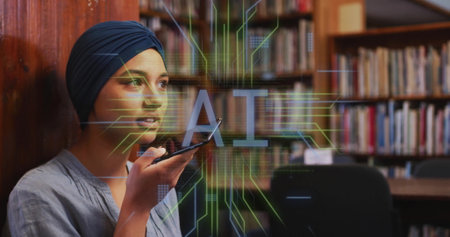 Image of ai text and data over biracial female student in hijab with smartphone. Global artificial intelligence, connections, computing and data processing concept digitally generated image.の写真素材