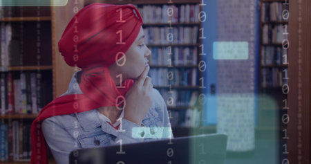 Image of ai text and data over biracial female student in hijab with laptop. Global artificial intelligence, connections, computing and data processing concept digitally generated image.の写真素材