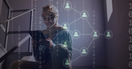 Image of ai binary coding and data over biracial female student using tablet. Global artificial intelligence, connections, computing and data processing concept digitally generated image.の写真素材