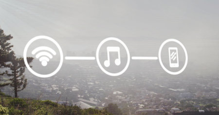 Image of network of wifi and media icons over modern cityscape. Network, data, digital interface, connection, business and communication, digitally generated image.の写真素材