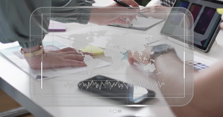 Image of screen with data processing over diverse business people in office. Global finance, business, connections, computing and data processing concept digitally generated image.の写真素材