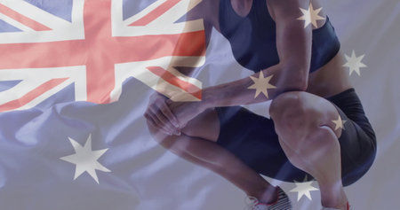 Image of flag of australia over caucasian female athlete. Global sports, sport disciplines and flags concept digitally generated image.の写真素材