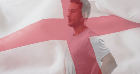 Image of flag of england over caucasian male athlete. Global sports, competition and patriotism concept digitally generated image.の写真素材