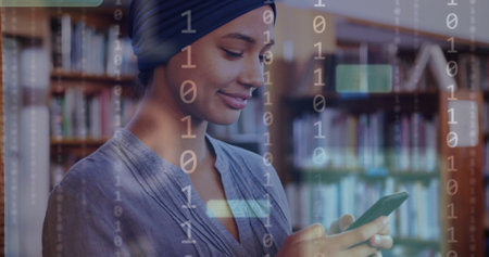 Image of ai text and data over biracial female student in hijab with smartphone. Global artificial intelligence, connections, computing and data processing concept digitally generated image.の写真素材