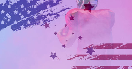 Image of caucasian american football player and flag of usa. American patriotism, sports and competition concept digitally generated image.の写真素材