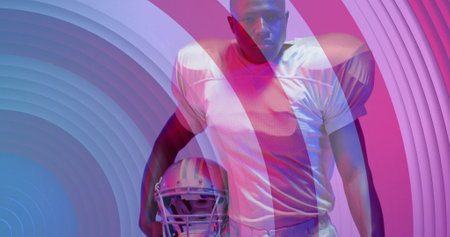 Image of african american american football player and flag of usa. American patriotism, sports and competition concept digitally generated image.の写真素材