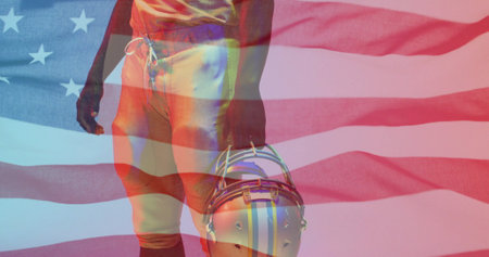 Image of african american american football player with helmet and flag of usa. American patriotism, sports and competition concept digitally generated image.の写真素材