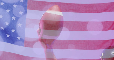 Image of caucasian american football player holding ball and flag of usa. American patriotism, sports and competition concept digitally generated image.の写真素材
