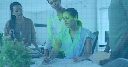 Image of padlock icon over diverse business people having meeting at office. Global business, online security and digital interface concept digitally generated image.の写真素材