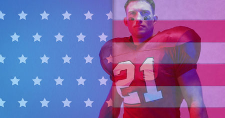 Image of african american american football player with ball and flag of usa. American patriotism, sports and competition concept digitally generated image.の写真素材