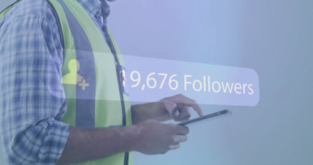 Followers image over construction worker wearing safety gear. digital, technology, social media, hard hat, workwear, helmetの写真素材