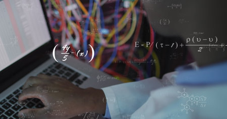 Image of mathematical equations over african american male engineer using laptop at server room. Computer interface and business data storage technology conceptの写真素材