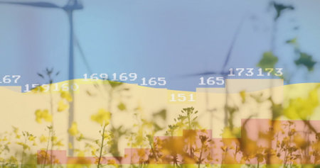Image of data processing and diagrams over flag of ukraine and wind turbines. Global business, patriotism and ecology concept, digitally generated image.の写真素材