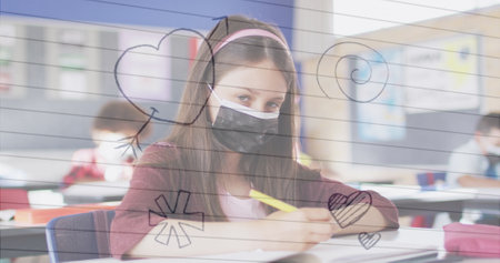 Multiple icons over white lined paper against caucasian girl studying in the class at school. school and education conceptの写真素材