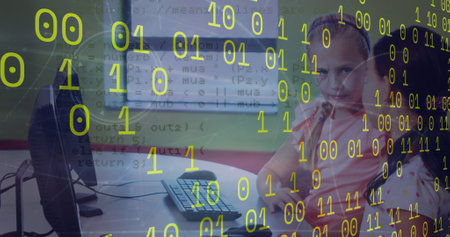Image of binary coding and data processing against two diverse girls using computer at school. School and education technology conceptの写真素材