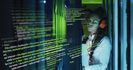 Image of data processing over african american female engineer using laptop at server room. Computer...