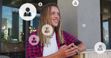 Image of profile icons in circles over smiling biracial woman scrolling on smartphones. Digital...