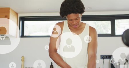 Image of multiple profile icons over african american athlete cutting fruit in kitchen at home....
