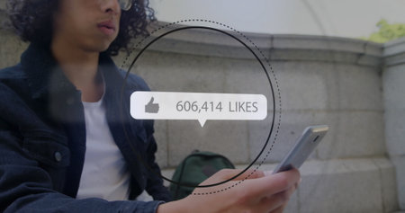 Image of changing numbers, icons in notification bar, circles, biracial man using smartphone....