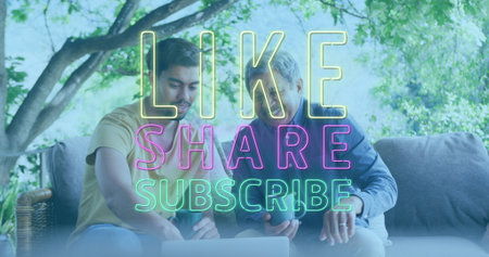 Image of like, share, subscribe social media text over diverse men using laptop. global social media, digital interface and technology concept digitally generated image.の写真素材