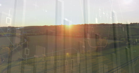 Image of financial graphs over agricultural field and landscape. agriculture, finance and economy concept digitally generated image.の写真素材