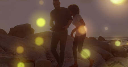 Image of spots over diverse couple walking. Free time and digital interface concept digitally generated image.の写真素材