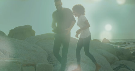 Image of businessman handshake over clouds and cityscape. Global business connections digital interface and technology concept digitally generated image.の写真素材