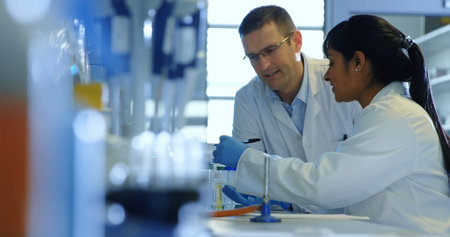 Image of school days text over diverse scientists in lab. Global education, science and digital...