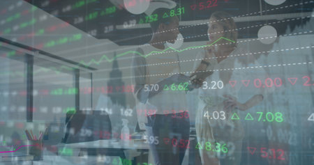 Image of financial data processing over diverse businesswomen. Global business, finances, computing and data processing concept digitally generated image.の写真素材