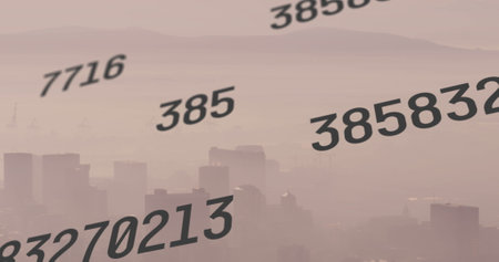 Image of numbers, financial data processing over cityscape. Global business, finance, networks, computing and data processing concept digitally generated image.の写真素材