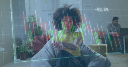 Image of financial data processing over biracial businesswoman working in office. Global business, finance, computing and data processing concept digitally generated image.の写真素材