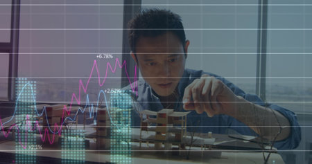 Image of financial data processing over asian businessman. Global finances, business and digital...