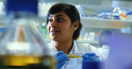 Image of data processing over biracial laboratory scientist. Global science and data processing concept digitally generated image.の写真素材