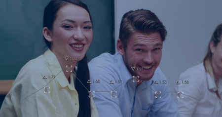 Image of mathematical equations over schoolchildren using computers. Elementary school education and learning concept digitally generated image.の写真素材