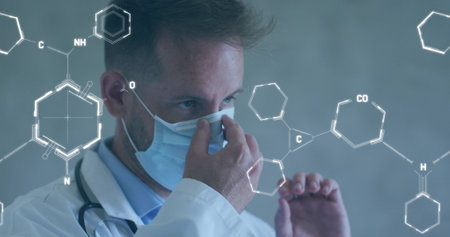 Image of chemical structures and data processing over caucasian male doctor with face mask. Global...